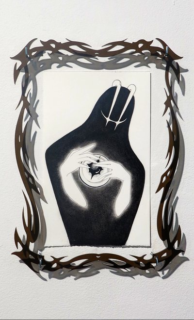 Framed drawing of a dark hooded figure, the frame woven from thorned branches.